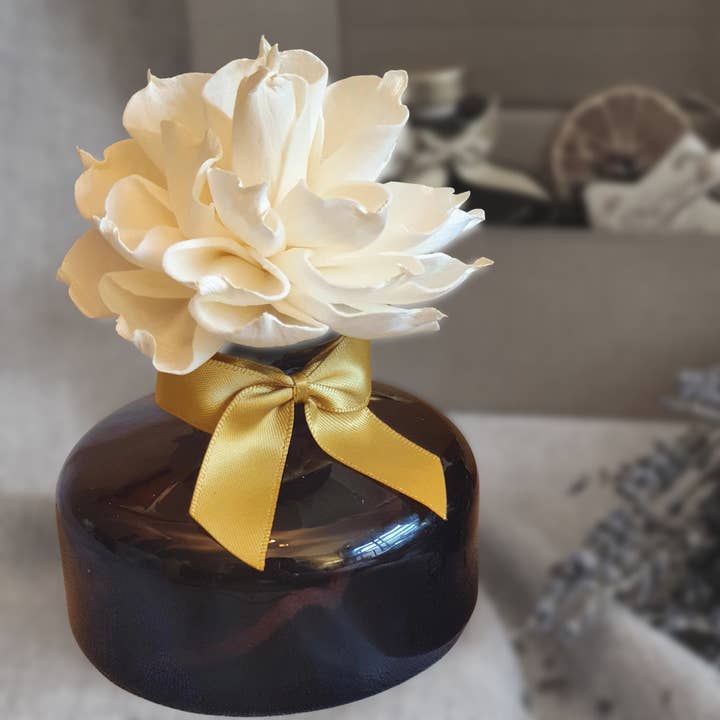 Luxury amber glass fragrance diffuser with sola wood flower